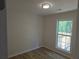 Well-lit bedroom with hardwood floors and a window offering a green view at 2065 Verbena St, Atlanta, GA 30314