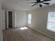 Sunlit bedroom with ceiling fan, closet and a view at 2065 Verbena St, Atlanta, GA 30314