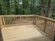 New deck overlooking a wooded backyard provides a private outdoor space to enjoy nature at 2065 Verbena St, Atlanta, GA 30314