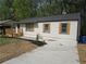 Charming one-story home with new landscaping, a deck, and a concrete driveway at 2065 Verbena St, Atlanta, GA 30314