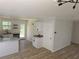 Open floor plan features kitchen with an exterior door and living area at 2065 Verbena St, Atlanta, GA 30314