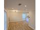 Spacious living room featuring modern lighting and laminate floors at 2065 Verbena St, Atlanta, GA 30314