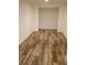 Empty room features wood-look flooring and leads to another room at 2065 Verbena St, Atlanta, GA 30314