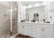 Bathroom with a glass shower, double sink vanity with modern fixtures, and vanity lighting at 3533 Settlement Rd, Tucker, GA 30084
