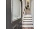 Interior shot of the stairs inside a home; the stairs are modern with wooden rails at 3533 Settlement Rd, Tucker, GA 30084