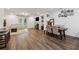 Open-concept living and dining area featuring hardwood floors and natural light at 3533 Settlement Rd, Tucker, GA 30084