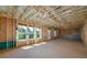 Unfinished basement space with visible framing and windows, offering potential for customization and expansion at 4725 Young Deer Dr, Cumming, GA 30041