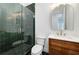 Bathroom featuring an enclosed shower, wood vanity, and hexagon tiles at 4725 Young Deer Dr, Cumming, GA 30041