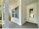 Inviting covered front porch with stylish accents showcasing the home's architectural details and providing a welcoming entrance at 4725 Young Deer Dr, Cumming, GA 30041