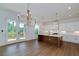 Modern kitchen boasts a large center island with white countertops and stainless steel appliances, perfect for culinary enthusiasts at 4725 Young Deer Dr, Cumming, GA 30041