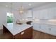 Elegant kitchen with a large center island, pendant lighting, and ample counter space, creating a chef-inspired culinary haven at 4725 Young Deer Dr, Cumming, GA 30041