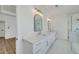 Main bathroom features double sink vanity, marble floors, and enclosed shower at 4725 Young Deer Dr, Cumming, GA 30041