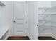 Well-organized pantry with wire shelving. Additional storage with a bench for your convenience at 4725 Young Deer Dr, Cumming, GA 30041
