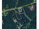Aerial view of a wooded property with a home and surrounding landscape at 5070 Smithfield Rd, Bowdon, GA 30108