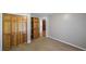 A spacious bedroom with a large closet and plush carpet offers a cozy and inviting retreat at 5070 Smithfield Rd, Bowdon, GA 30108