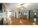 An open-concept living area with hardwood floors offers a versatile space for living and dining at 5070 Smithfield Rd, Bowdon, GA 30108