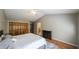 Spacious main bedroom with vaulted ceiling, fireplace, closet and ensuite bathroom at 5070 Smithfield Rd, Bowdon, GA 30108