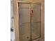 Bathroom featuring a glass-enclosed shower with built-in shelving at 1104 Aqua Shore Dr, Mcdonough, GA 30252