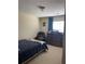 Cozy bedroom featuring neutral walls, carpet, and a comfortable seating area at 1104 Aqua Shore Dr, Mcdonough, GA 30252