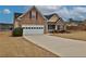 Charming brick home with a two-car garage, well-maintained lawn, and a welcoming entrance at 1104 Aqua Shore Dr, Mcdonough, GA 30252