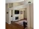 Inviting living room featuring a fireplace, tv, and hardwood flooring at 1104 Aqua Shore Dr, Mcdonough, GA 30252