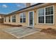 Backyard patio with a dark shingle roof and vinyl siding at 1104 Aqua Shore Dr, Mcdonough, GA 30252