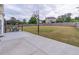 Spacious backyard features a basketball hoop and patio with seating area at 115 Westbury Ln, Johns Creek, GA 30005