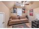 Bedroom features a cozy sofa, fan, and fun Chicago sports decor for a great hangout space at 115 Westbury Ln, Johns Creek, GA 30005