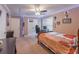 Large bedroom has fan, desk, closet, and decor. A comfortable space for sleep and study at 115 Westbury Ln, Johns Creek, GA 30005