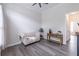 Cozy living room with modern decor, neutral colors, and wood floors at 115 Westbury Ln, Johns Creek, GA 30005