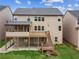Exterior showcasing a backyard with a deck and patio at 2539 Larson Creek Cove, Duluth, GA 30097