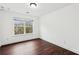 Bedroom featuring a window and hardwood floors at 2539 Larson Creek Cove, Duluth, GA 30097