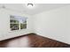 Bedroom featuring a window and hardwood floors at 2539 Larson Creek Cove, Duluth, GA 30097