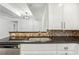 Open kitchen with stainless steel appliances and granite countertops at 2539 Larson Creek Cove, Duluth, GA 30097