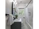 Renovated bathroom featuring tile floors, a vanity sink, and a shower tub at 3046 Valley Cir, Decatur, GA 30033