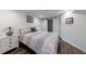 Modern bedroom with hardwood floors, a sliding closet door, and a striped comforter at 3046 Valley Cir, Decatur, GA 30033