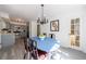 Bright dining area next to the kitchen with grey cabinets and stainless steel appliances at 3046 Valley Cir, Decatur, GA 30033