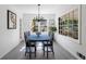 Dining room featuring hardwood floors, modern light fixture, and natural light at 3046 Valley Cir, Decatur, GA 30033