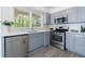 Updated kitchen features stainless steel appliances, stone countertops, and natural light at 3046 Valley Cir, Decatur, GA 30033