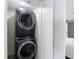 Newer front load washer and dryer are stacked to save space at 3046 Valley Cir, Decatur, GA 30033