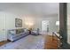 Bright living room with hardwood floors, neutral paint, lots of light, and view into the dining area at 3046 Valley Cir, Decatur, GA 30033