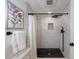 Modern walk-in shower with white subway tiles and black fixtures at 3046 Valley Cir, Decatur, GA 30033