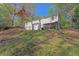 Spacious grassy backyard with mature trees at 5942 Morgan Rd, Atlanta, GA 30340