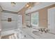 Bathroom featuring double vanity, updated fixtures, granite counters, and tile flooring at 5942 Morgan Rd, Atlanta, GA 30340
