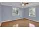 Spacious bedroom with hardwood floors and views from two sunny windows at 5942 Morgan Rd, Atlanta, GA 30340