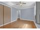 Spacious bedroom with hardwood floors, closet, and a bright window at 5942 Morgan Rd, Atlanta, GA 30340