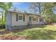 Charming single-story home with siding, a front porch, and lush landscaping at 5942 Morgan Rd, Atlanta, GA 30340