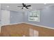 A bright living room featuring hardwood floors and a ceiling fan at 5942 Morgan Rd, Atlanta, GA 30340