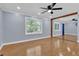 A bright living room featuring hardwood floors, a ceiling fan and a nice window at 5942 Morgan Rd, Atlanta, GA 30340