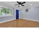 Living room features hardwood floors, natural light, and a striking blue front door at 5942 Morgan Rd, Atlanta, GA 30340